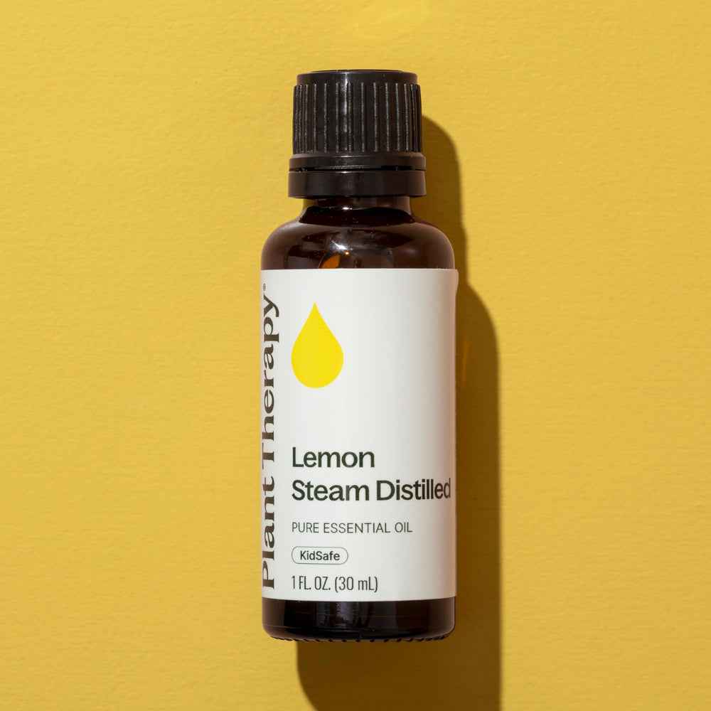 Plant Therapy lemon oil dropper beside bottle for easy blending.