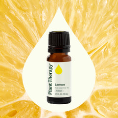Close-up of Plant Therapy Lemon Oil label with batch information.