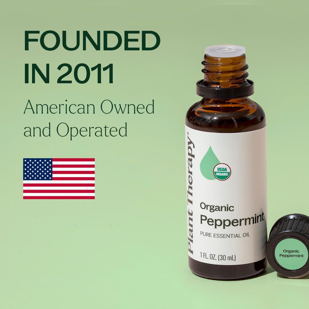 Plant Therapy peppermint oil bottle with cleaning spray for natural freshness.