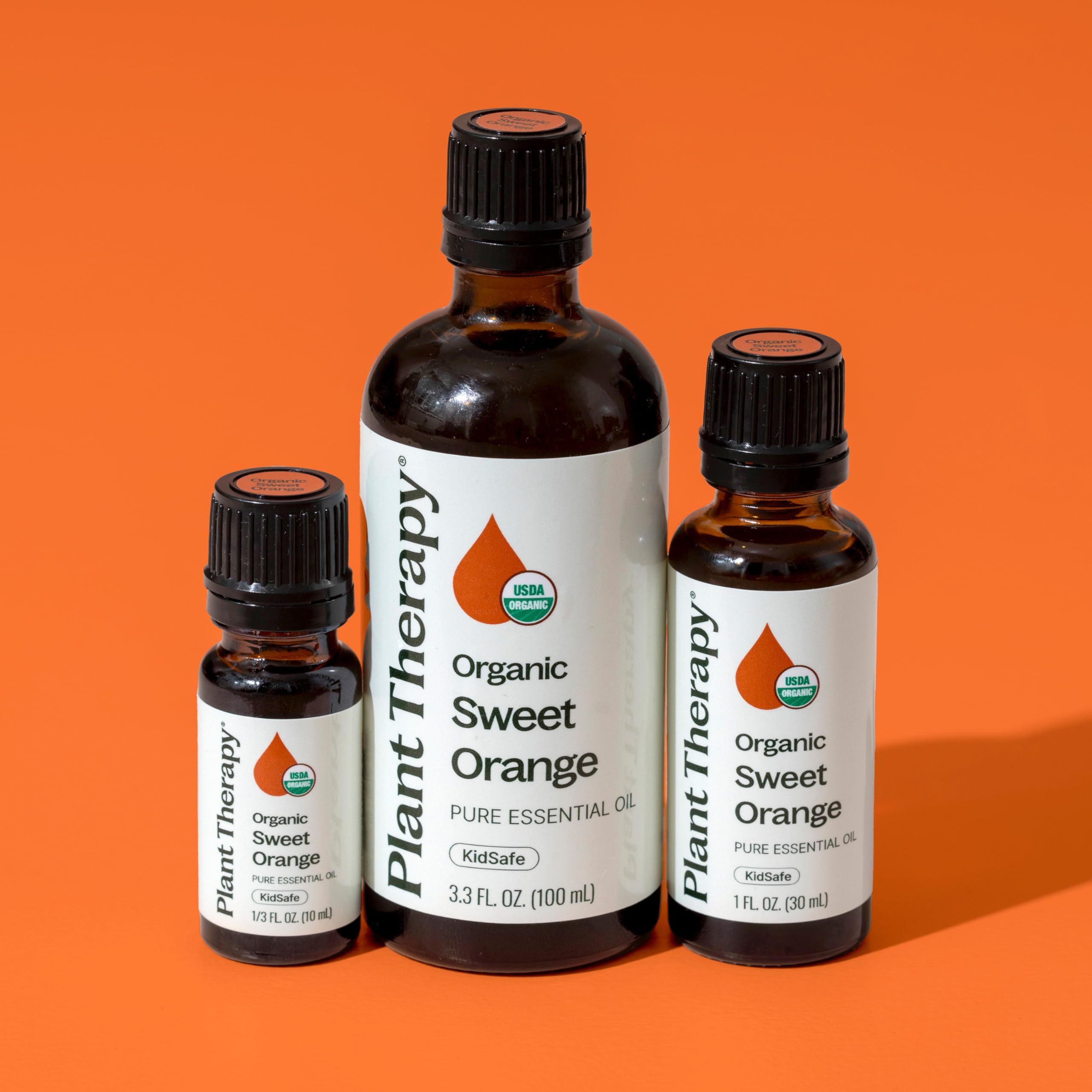 Bottle beside diffuser in a calm space, Plant Therapy Sweet Orange Organic oil