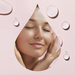Droppers dispensing Plant Therapy Younger Glo into palm for easy facial application.