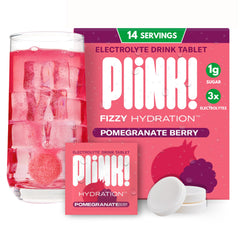 Plink! Pomegranate Berry fizzing tablet dissolving in water for refreshing hydration.