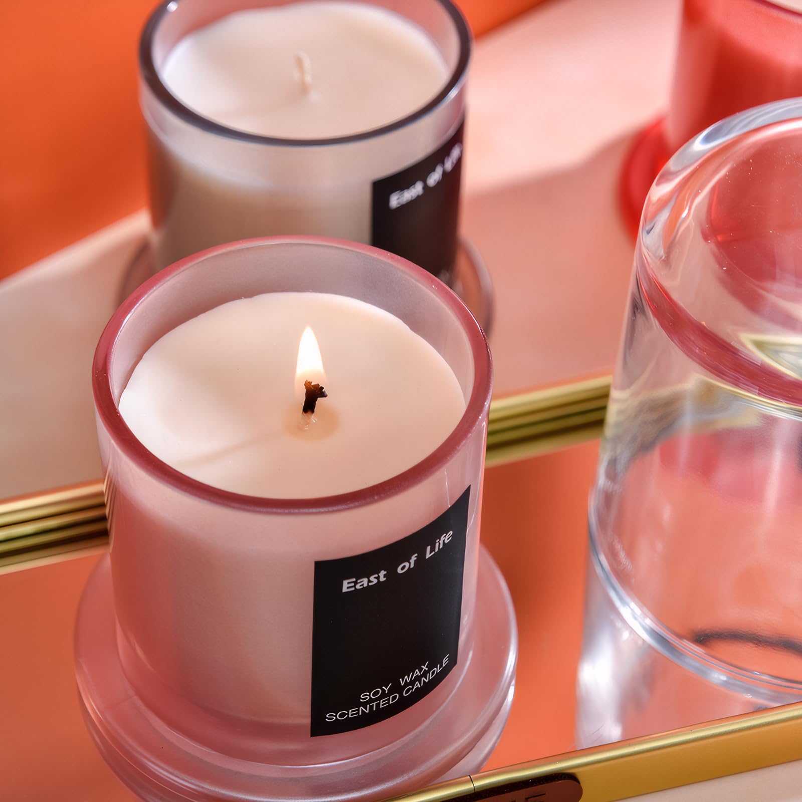 Exquisite glass cup candle with decorative packaging, ideal as a gift.