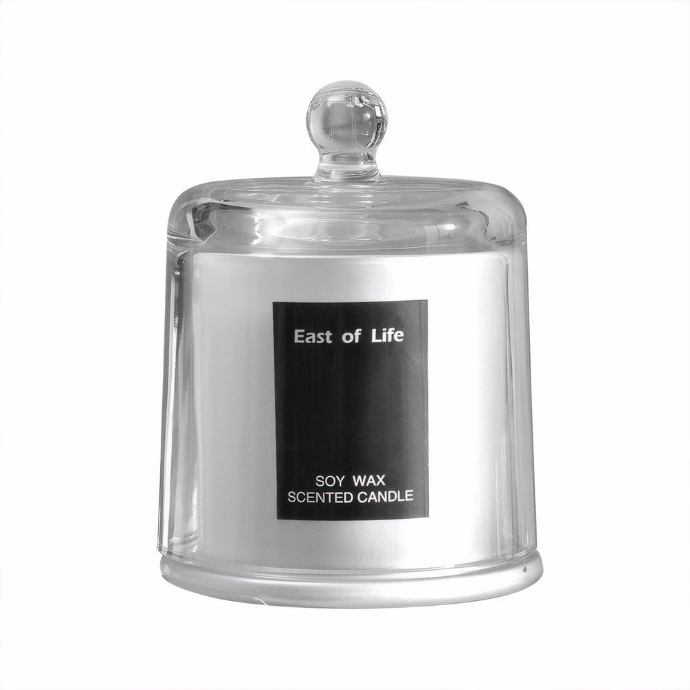 Plum Blossom Scented Candle in a glass cup for elegant room fragrance.