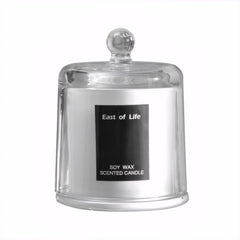 Plum Blossom Scented Candle in a glass cup for elegant room fragrance.