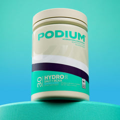 Pouring Hydro Salt powder into water for a refreshing drink.