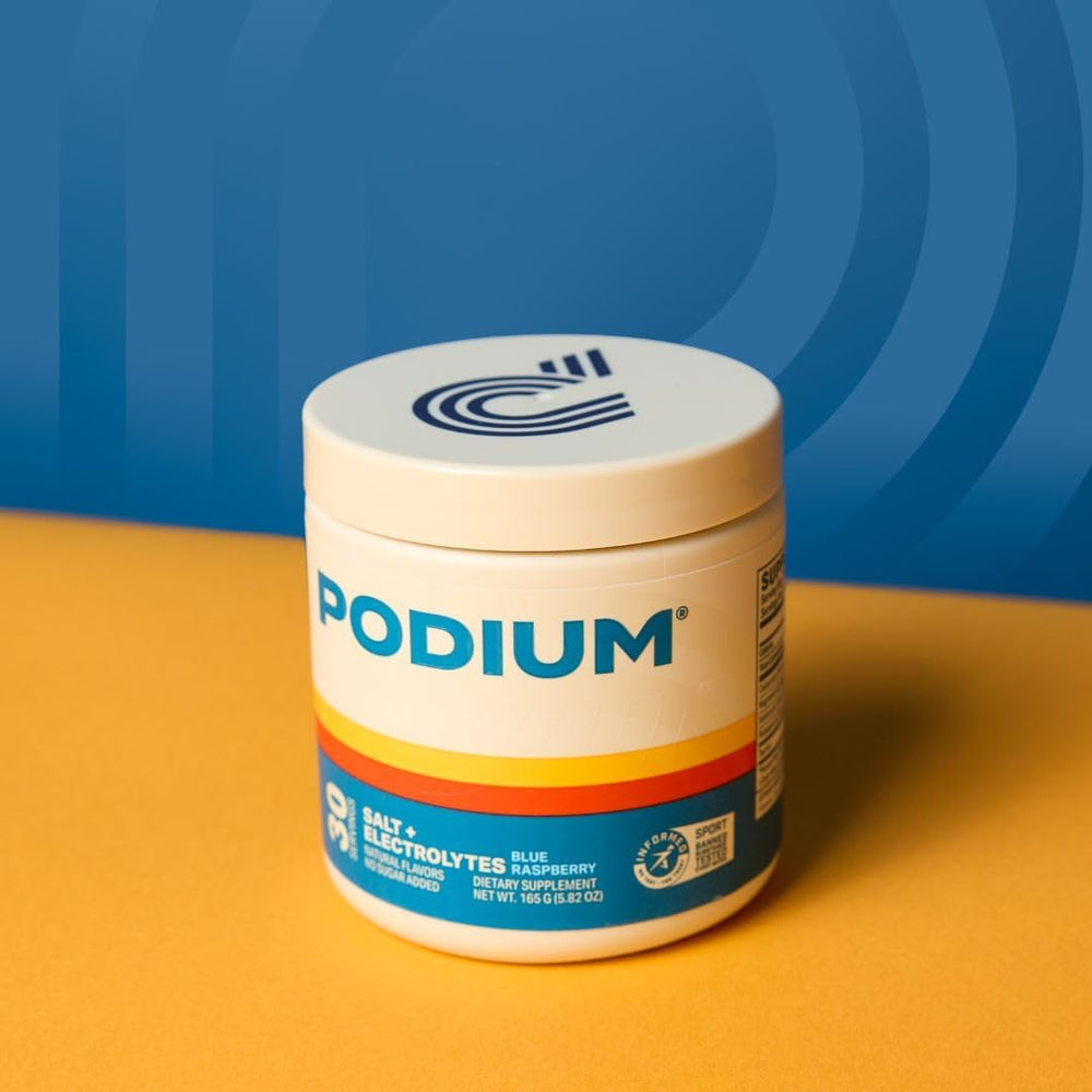 Podium Nutrition Salt+Electrolytes pouring into water shows easy pre- or post-workout hydration.