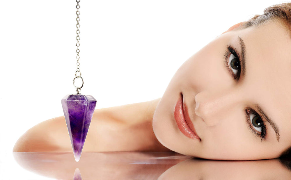 Close-up of Polar Jade amethyst crystal pendulum highlighting natural purple facets