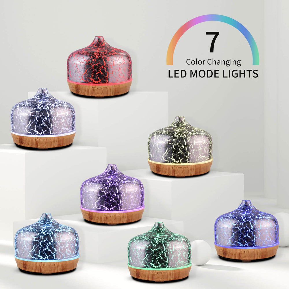 Porseme diffuser showcasing silver-plated glass cover and wood base in refined decor