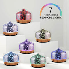 Porseme diffuser showcasing silver-plated glass cover and wood base in refined decor