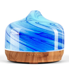 Porseme 500ml glass diffuser with handblown globe in a modern living room.