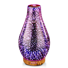 Porseme essential oil diffuser with rose gold glass cover glows softly to create a calming workspace.