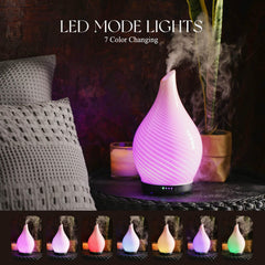 Porseme diffuser with wood-grain base adds natural decor while emitting calming mist.