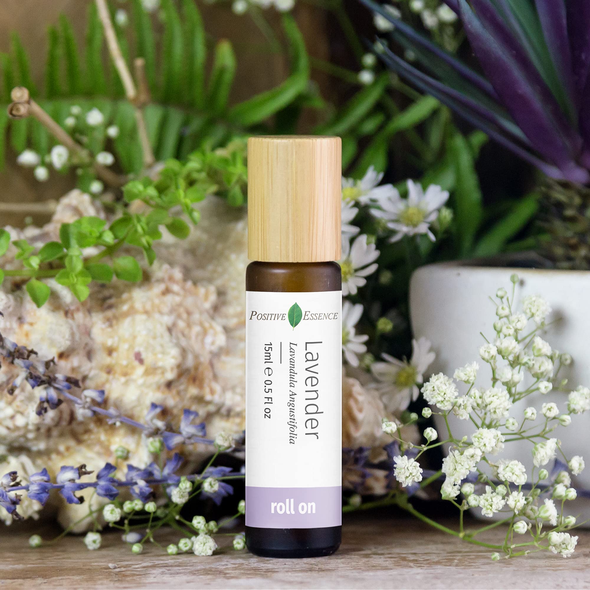 Positive Essence rollerball closeup showing smooth, leak-proof design for on-the-go use