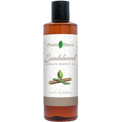 Positive Essence sandalwood massage oil bottle for a smooth, relaxing glide.