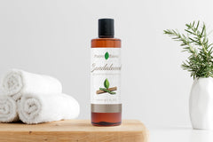 Positive Essence sandalwood massage oil pour for fast absorption and calm skin.