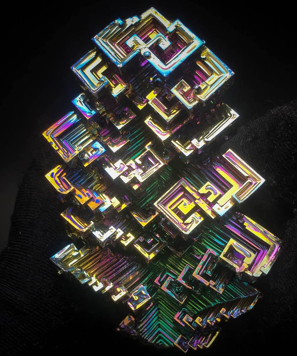 Pounique bismuth crystal fragile care reminder to handle gently.