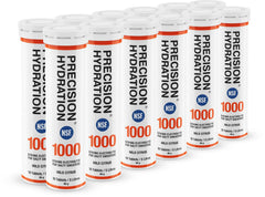 Tabletas de Precision Hydration disolviéndose en agua para una hidratación rápida durante entrenamientos.