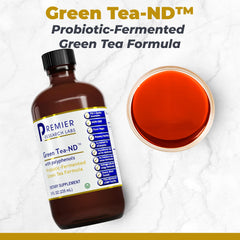 Premier Research Labs Green Tea-ND liquid dropper in use for probiotic delivery