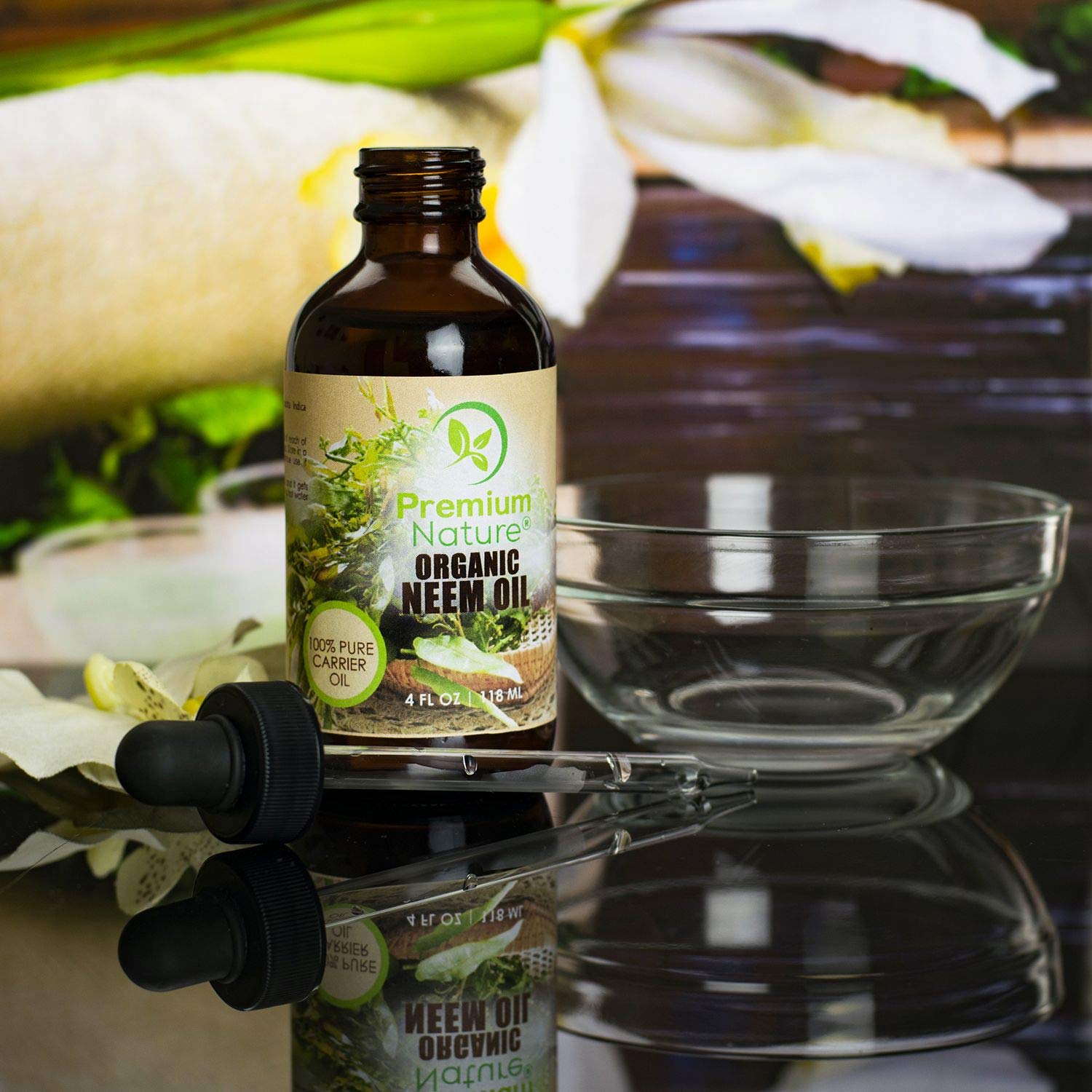 Premium Nature Neem Oil label close-up emphasizes 100% natural, unrefined quality.