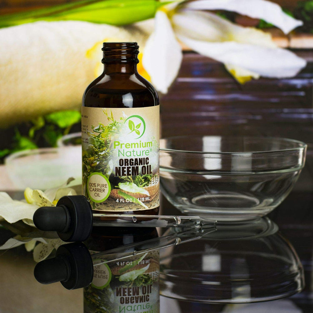 Premium Nature Neem Oil label close-up emphasizes 100% natural, unrefined quality.