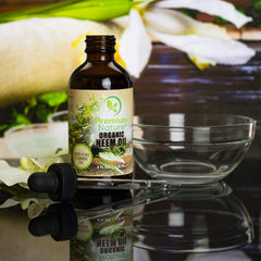 Premium Nature Neem Oil label close-up emphasizes 100% natural, unrefined quality.