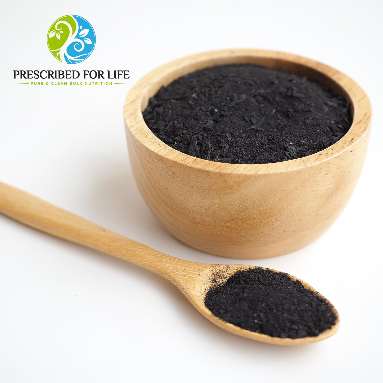 Prescribed For Life charcoal powder being poured into a small dish, ideal for odor control.
