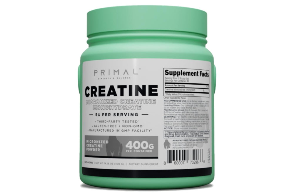 Scoop-dispense of Primal Creatine Monohydrate showing micronized powder.