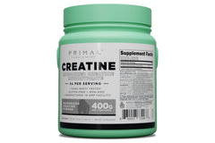 Scoop-dispense of Primal Creatine Monohydrate showing micronized powder.