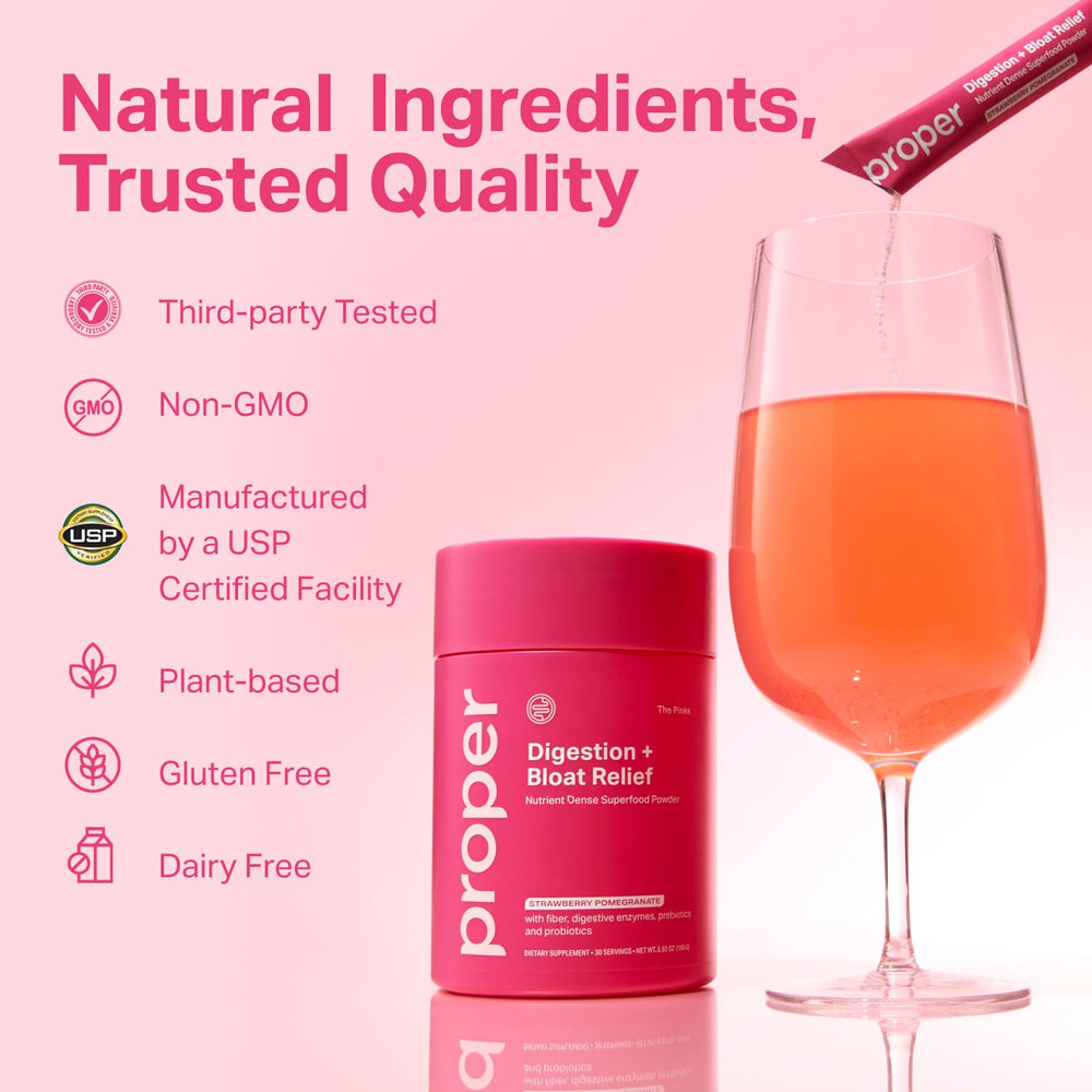 Proper Pinks powder dissolving in water in a clear glass for quick use.