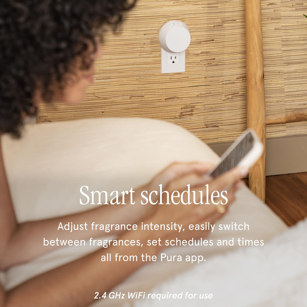 Pura 4 smart fragrance diffuser lit in a modern space