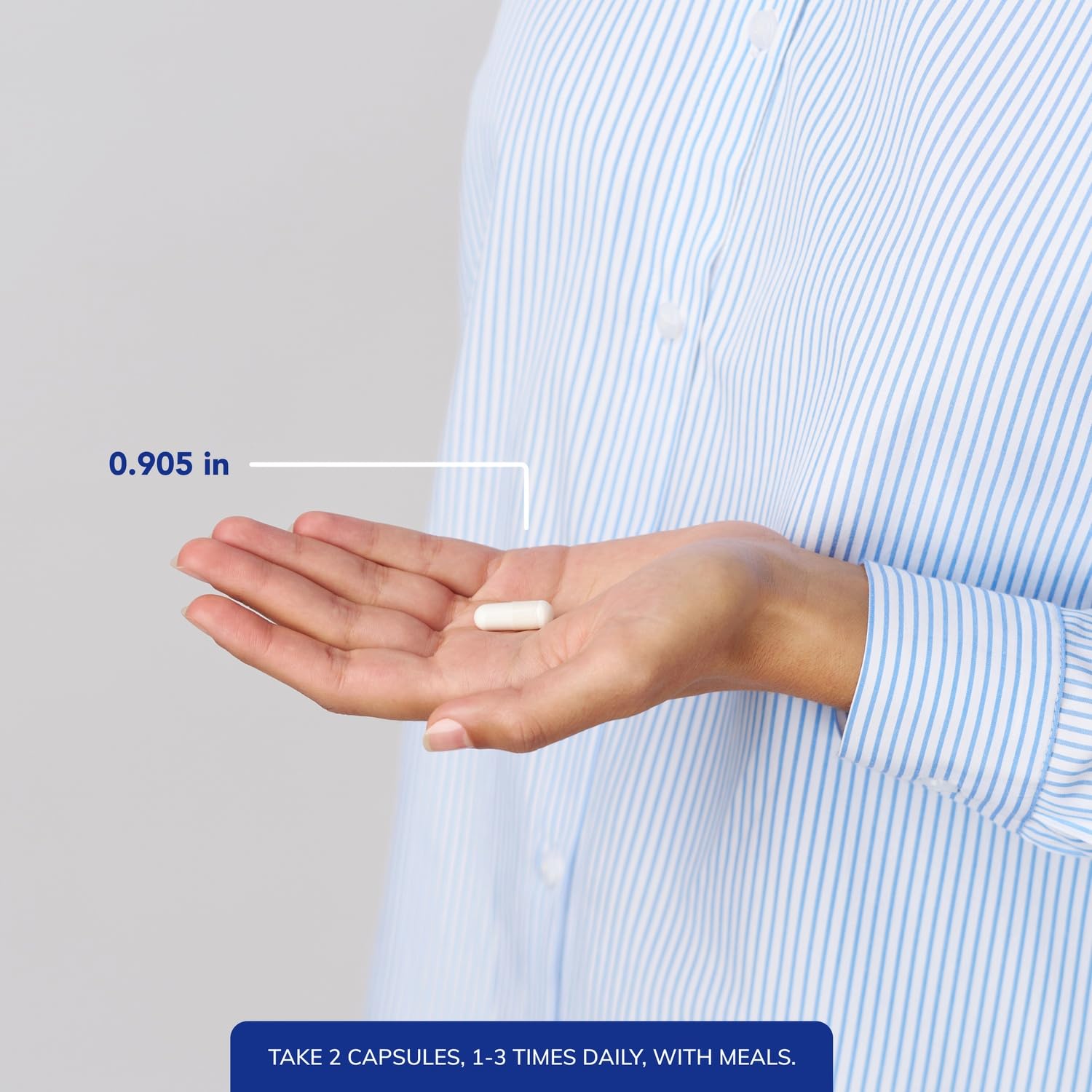 Capsules in a hand illustrating convenient daily dosage.