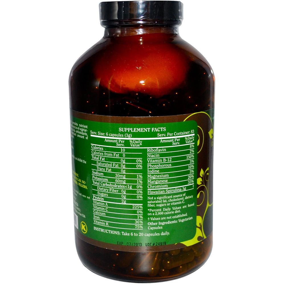 Pure Planet Spirulina capsules close-up on label, convenient vegan 500 mg daily.