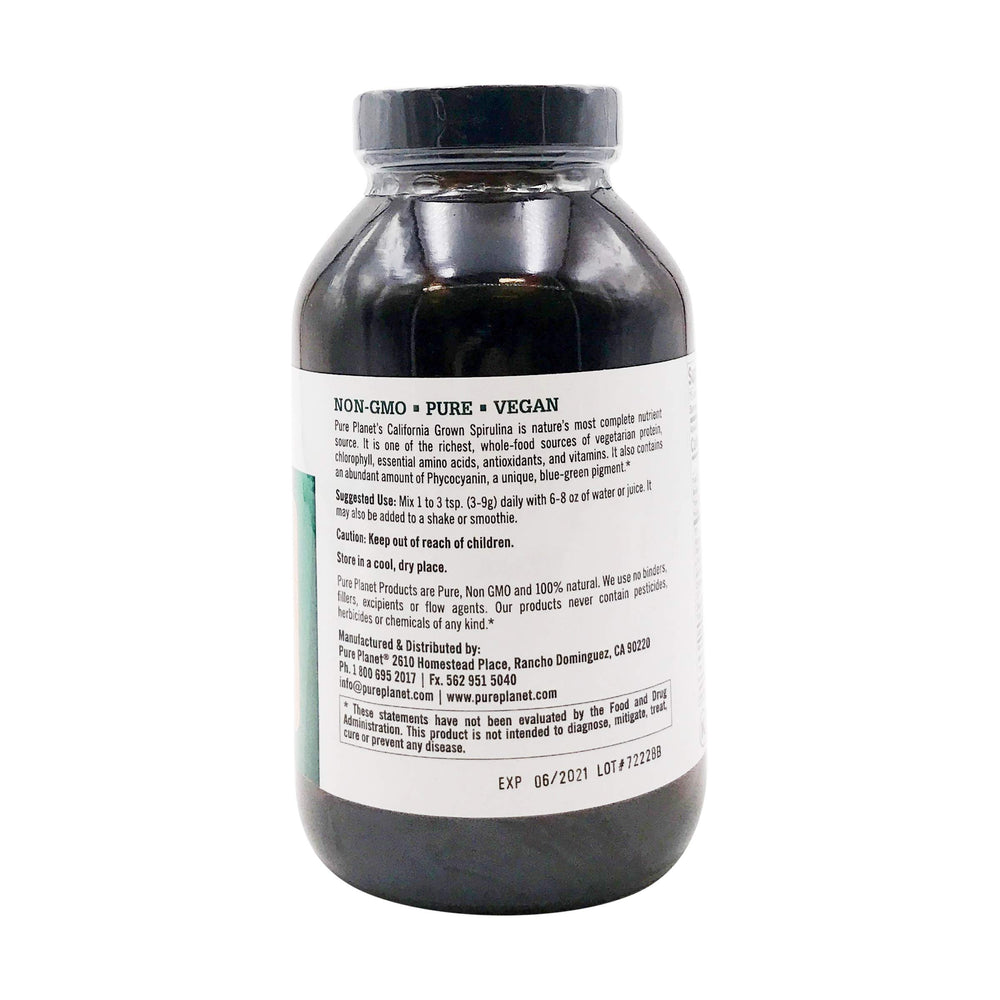 Pure Planet spirulina powder scoop beside the jar for smoothies.
