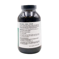 Pure Planet spirulina powder scoop beside the jar for smoothies.
