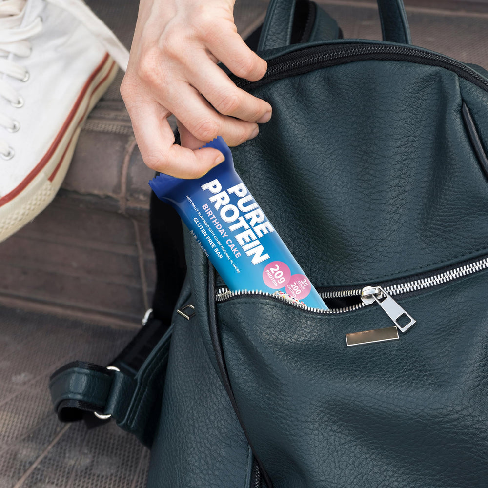 Pure Protein Birthday Cake bar with coffee, a convenient energy boost.
