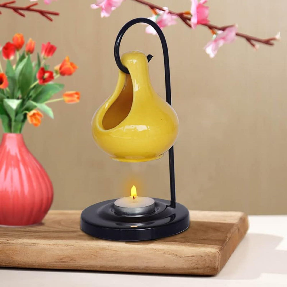 Pure Source India ceramic oil burner yellow, front view with tea light compatibility.