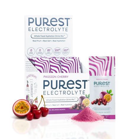Purest Electrolyte passion cherry bottle pouring for fast hydration during workouts