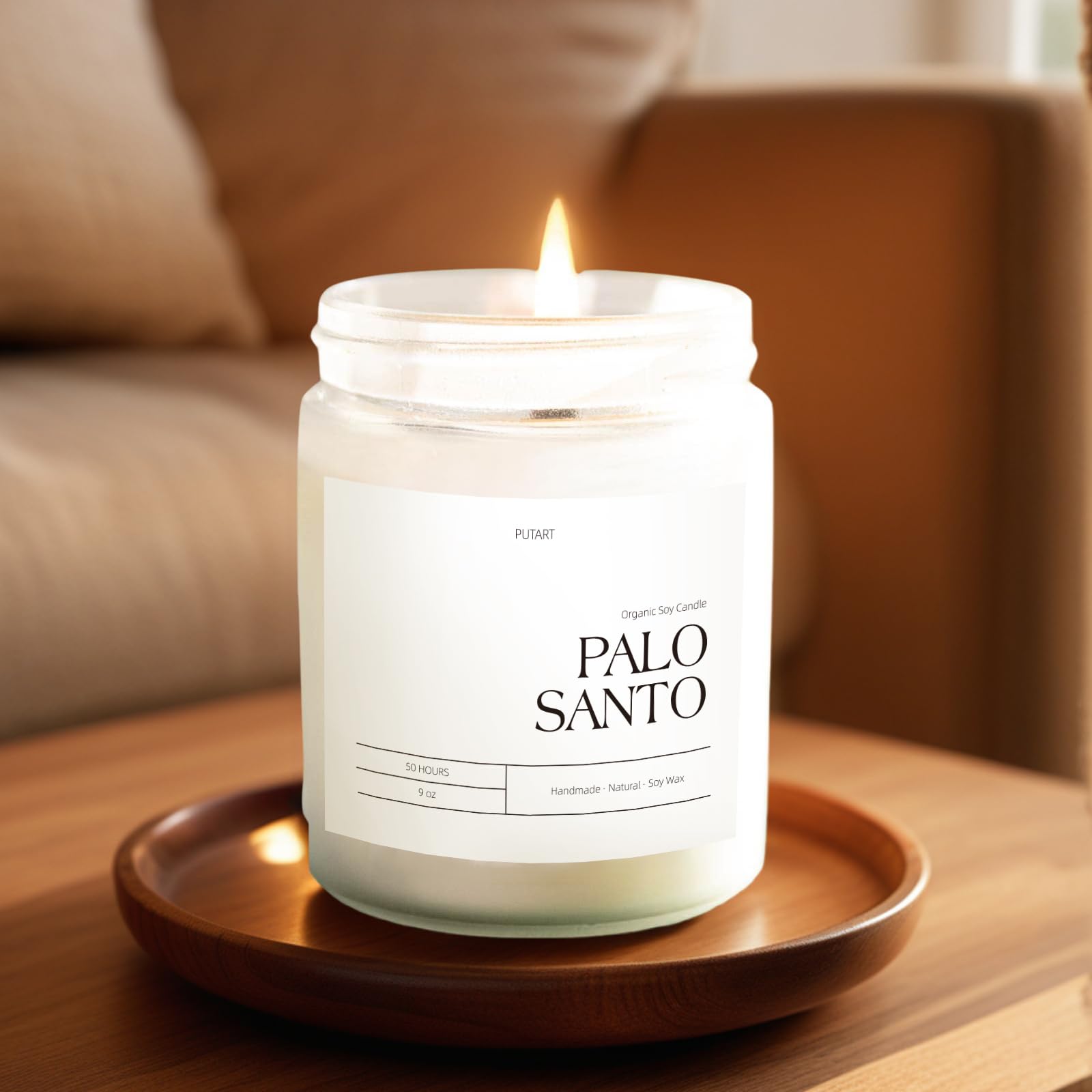 Lit Putart Palo Santo candle fills a room with a warm, inviting aroma.