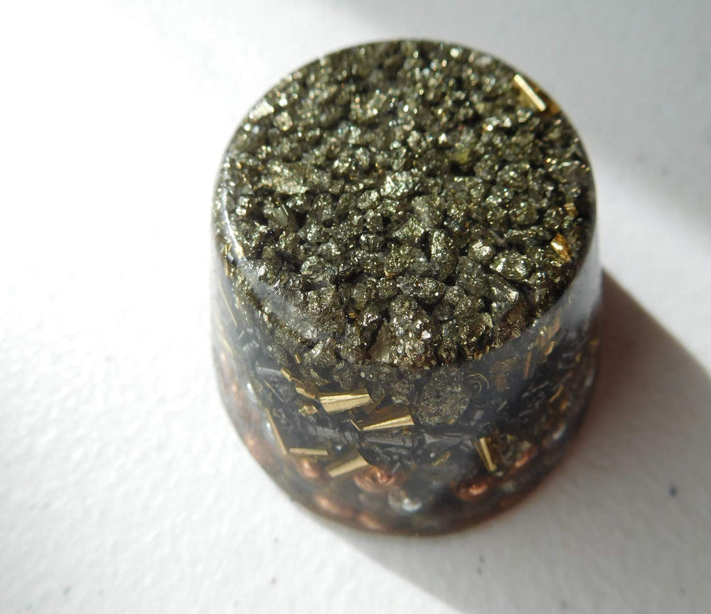 Pyrite single crystal tower buster closeup reveals sparkles for meditation spaces.
