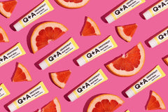 QA Grapefruit Multi-Balm on rough hands delivers lasting moisture.