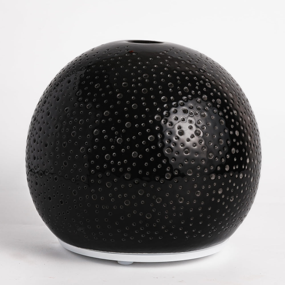 QCYBDGLOV ceramic diffuser front view enhances room ambiance with a gentle aroma.