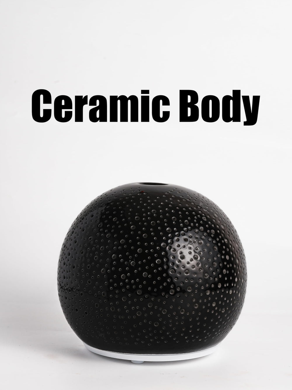 QCYBDGLOV compact diffuser in bedroom adds calm fragrance and gentle light.