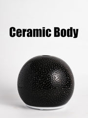 QCYBDGLOV compact diffuser in bedroom adds calm fragrance and gentle light.