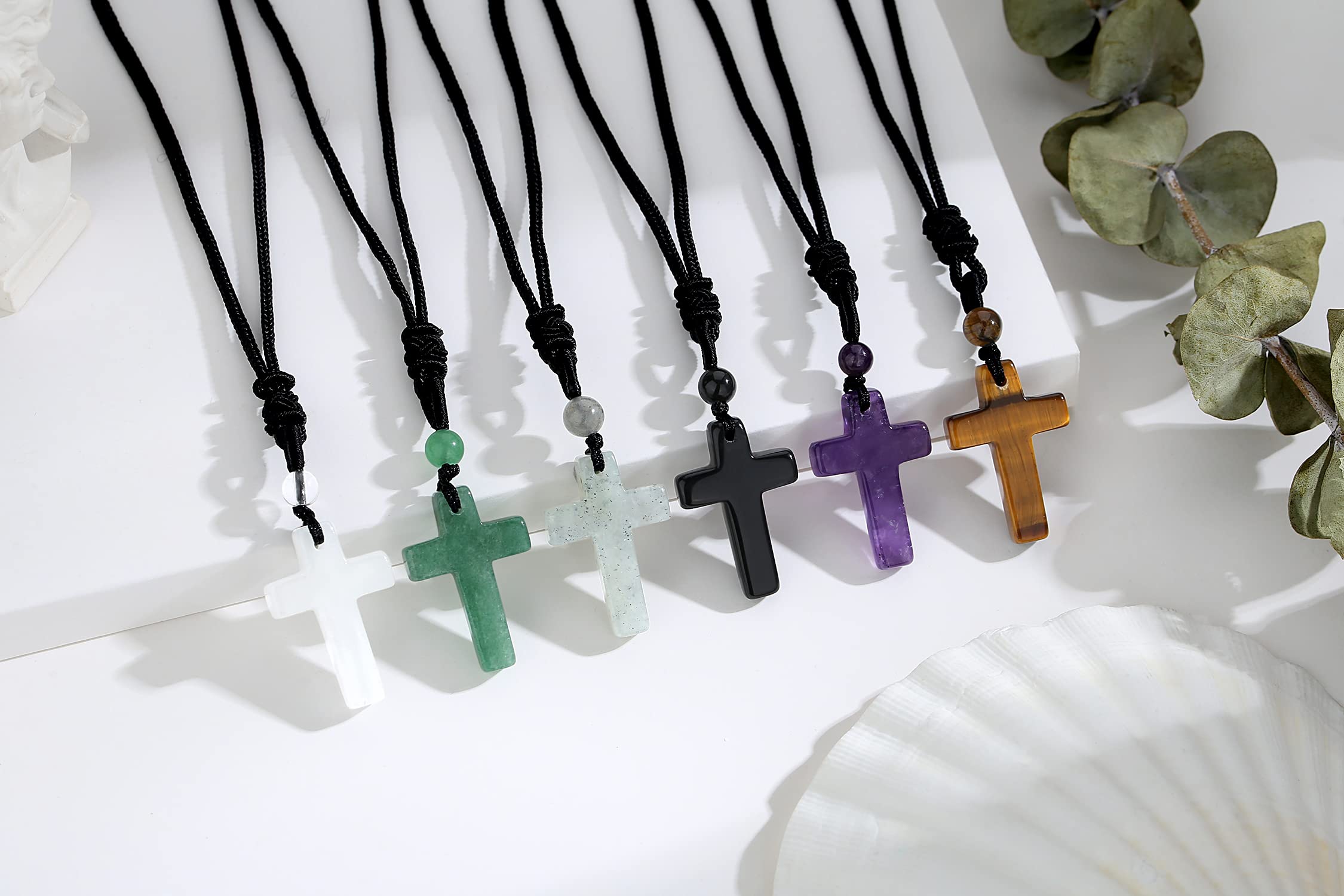 QINJIEJIE amethyst cross necklace on wrist showing lightweight comfort