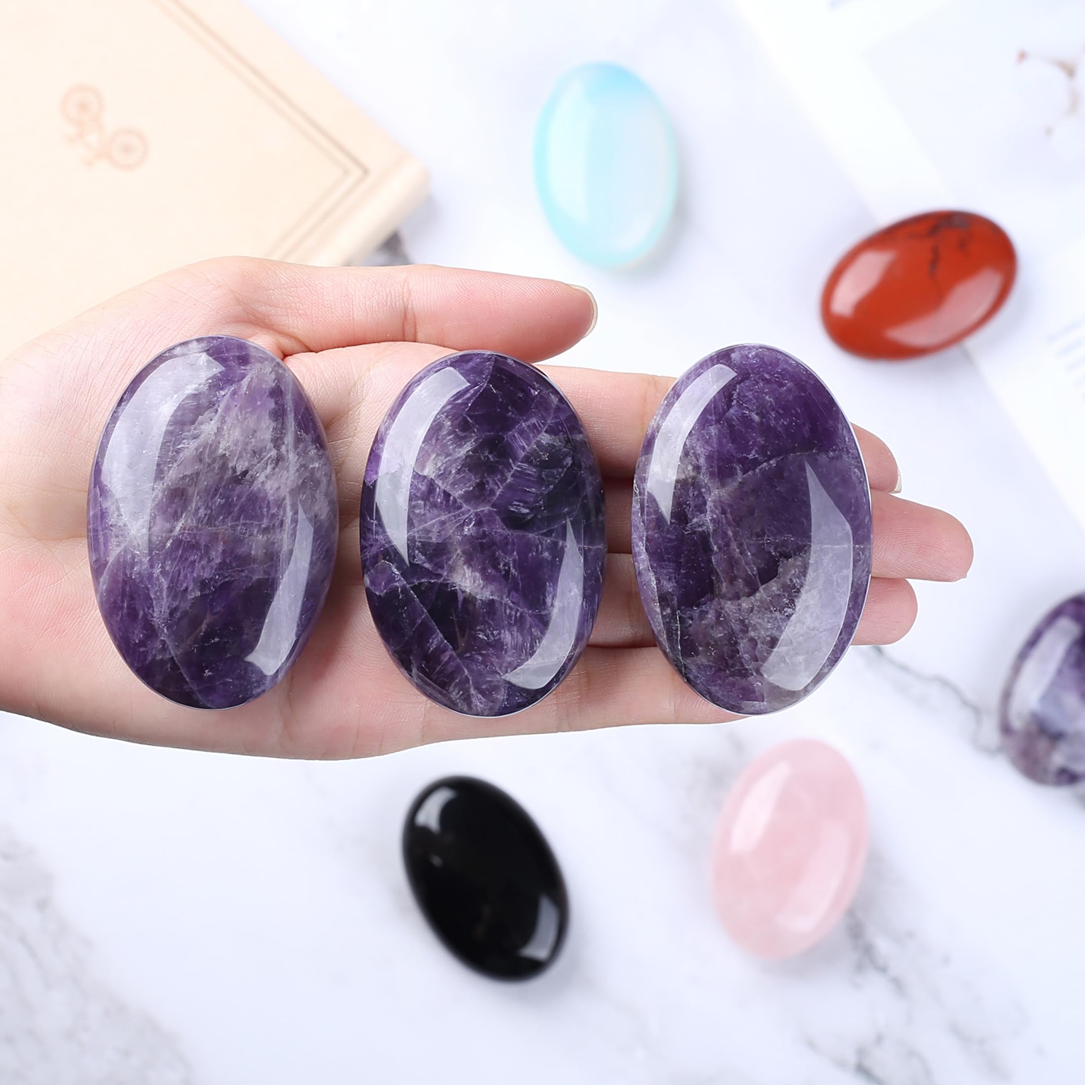 QINJIEJIE amethyst palm stone front view promotes relaxation and meditation.