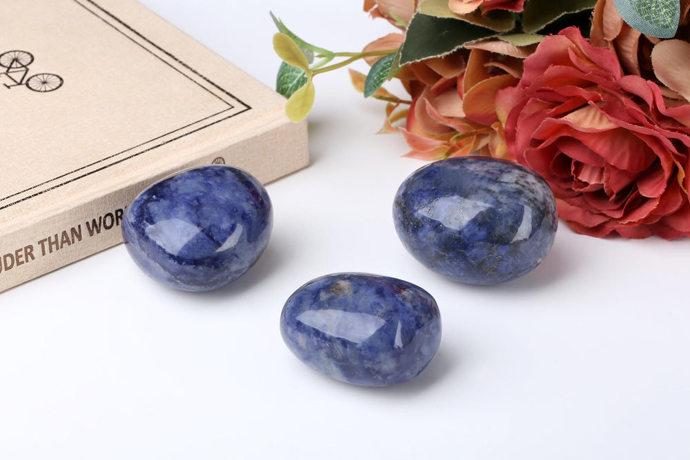 QINJIEJIE blue sodalite stone close-up highlighting polished texture for mindful practice.