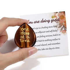 QINJIEJIE green aventurine gemstone in hand for grounding moments