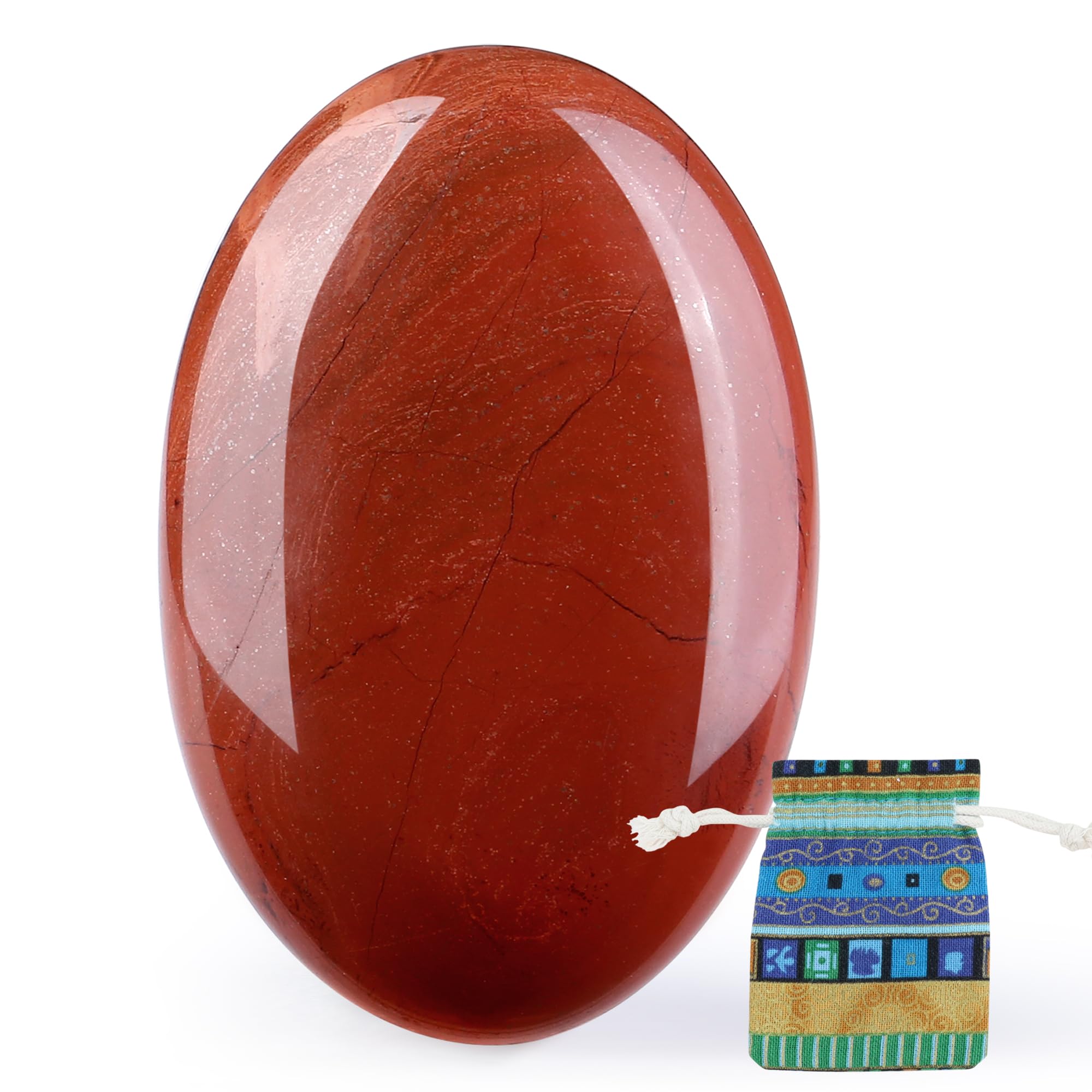 QINJIEJIE Red Jasper palm stone held in hand for focus and calm.