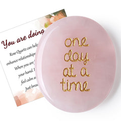 QINJIEJIE Worry Stone held in hand with smooth surface for grounding and focus.